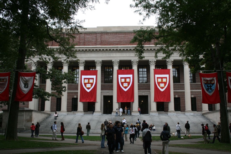 Harvard yard with large building and flags